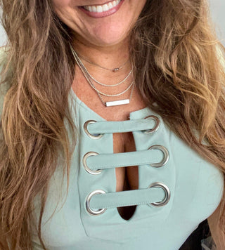 This model is wearing the Tonneau Horizontal. A hidden chastity key in silver